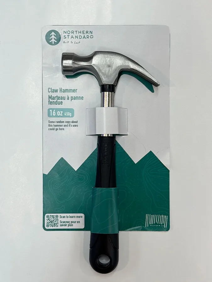 Second printed prototype with mountain shapes framing a vertically arranged claw hammer