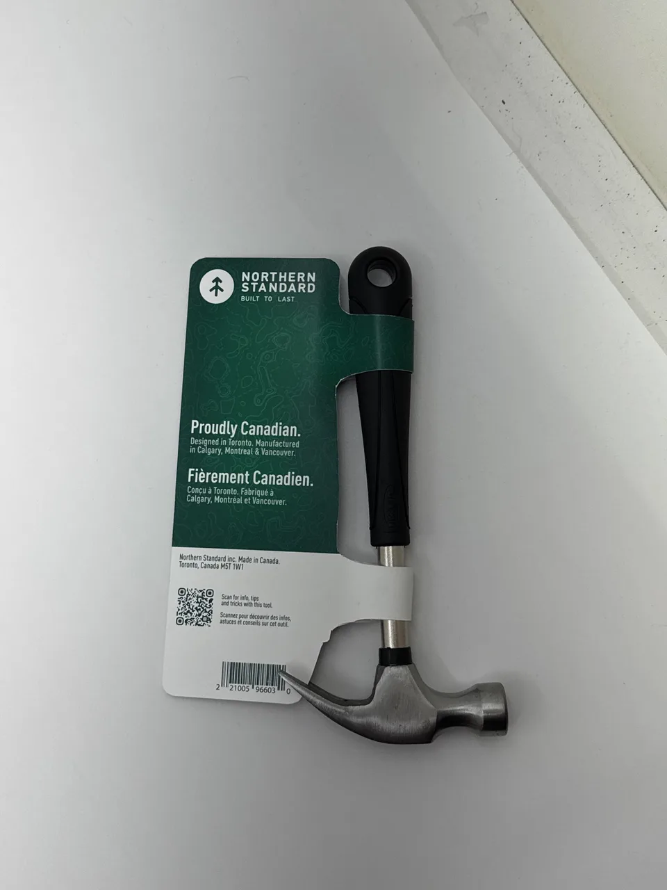 Back of the finished Northern Standard hammer prototype showing the reverse green package panel and supporting bilingual copy